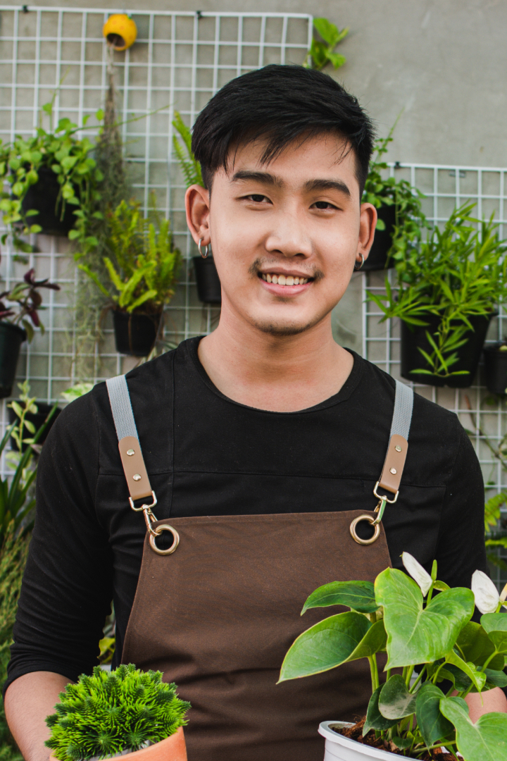 young-gardener-man-holding-beautiful-houseplant-in-2021-10-26-03-20-26-utc.jpg