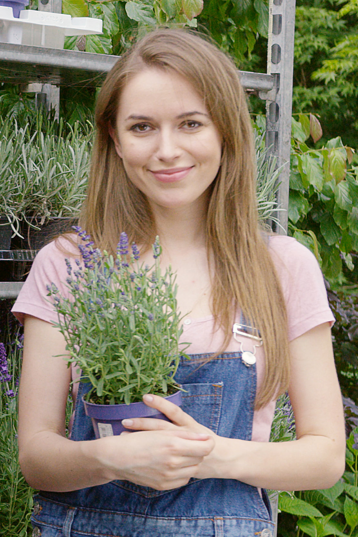 young-pretty-gardener-woman-posing-at-stand-with-p-2021-08-30-02-13-35-utc.jpg